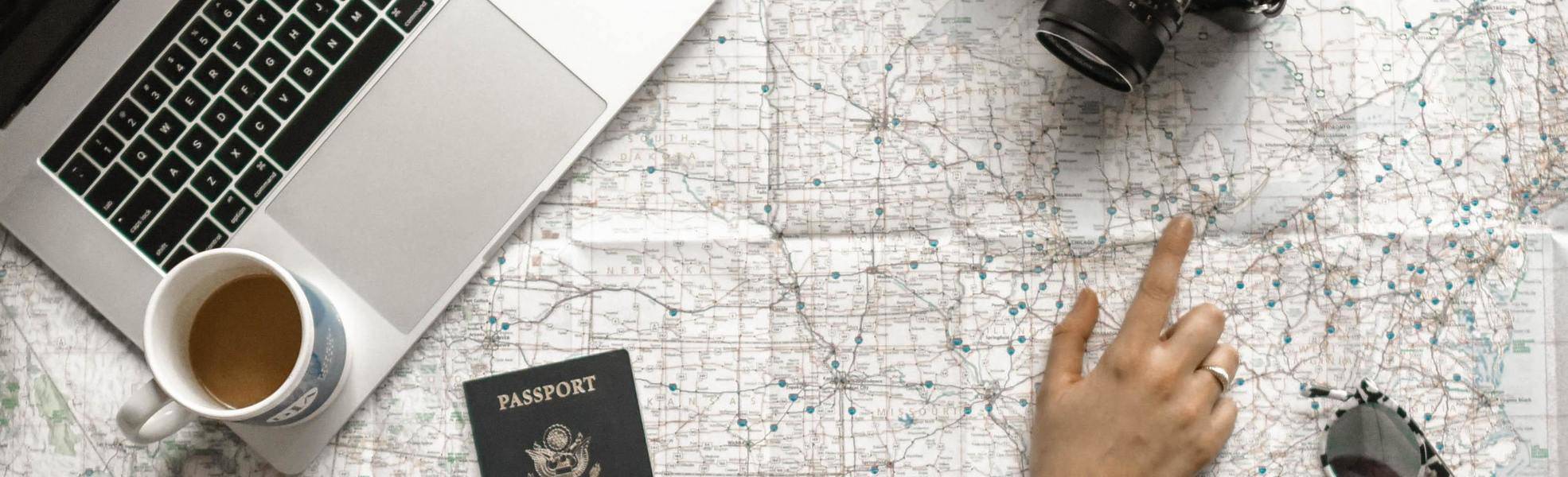 Looking at a map and other travel essentials - travel preparation