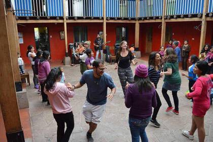 In the women's shelter in Cusco people sing and dance