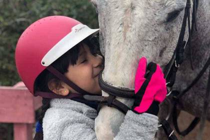 Children spend time with the horses