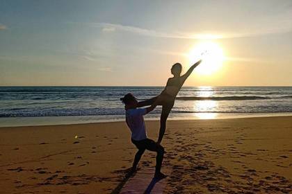 Yoga exercises on the beach in Thailand