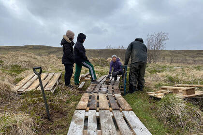 Volunteers work outdoors in Iceland