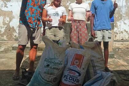 Bags of trash are collected during beach clean-ups.