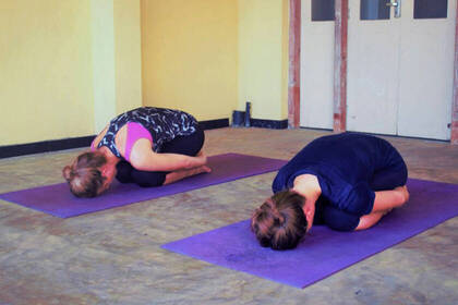 Guests doing a yoga exercise