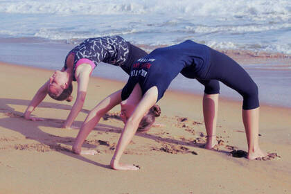 Yoga exercises on the beach